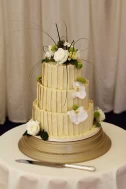 Ivory 3 Tier Pistachio Vow Renewal Cake With White Flowers