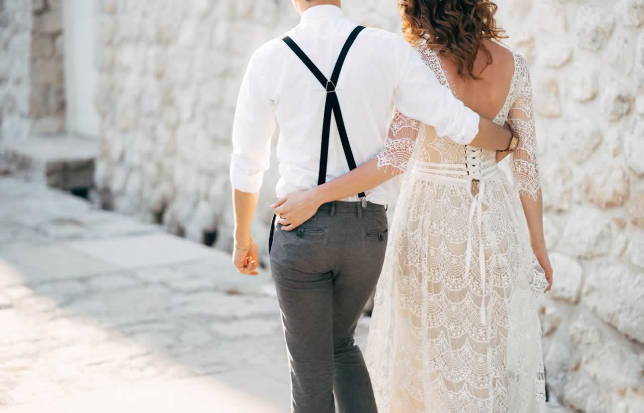 bride-and-groom-walk-along-the-old-pavements-of-th-2023-11-27-05-35-33-utc-m Vow Renewal Day-of Checklist: Essential Last-Minute Tasks for a Stress-Free Celebration