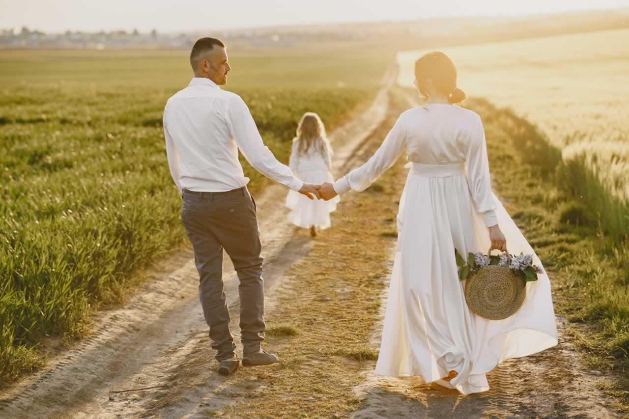 family-with-little-daughter-spending-time-together-sunny-field-s Countryside and Rustic Vow Renewal Locations: Discover Charm and Tranquility in Nature