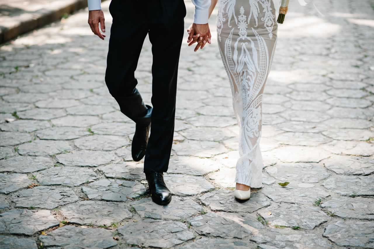 the-bride-and-groom-goes-ahead-on-the-pavement-and-2023-11-27-05-23-25-utc-m City Sophistication: An Urban Vow Renewal Story of Modern Style and Timeless Romance